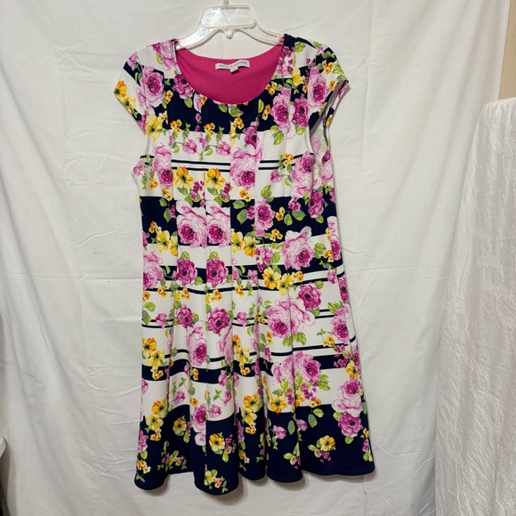 Emma & Michele floral cap-sleeve dress on a navy blue/white striped background. - Picture 2 of 12